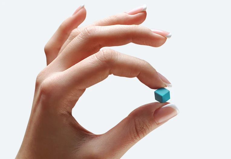 Hand holding a PIXIO cube